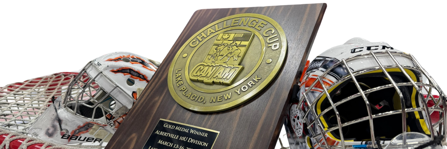Plaque on net with goalie helmets